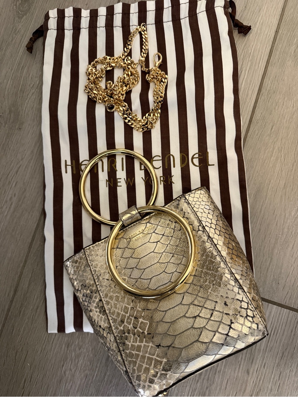 henri bendel Gold Metallic Snake-Embossed Ring-Handle Wristlet - hard to find